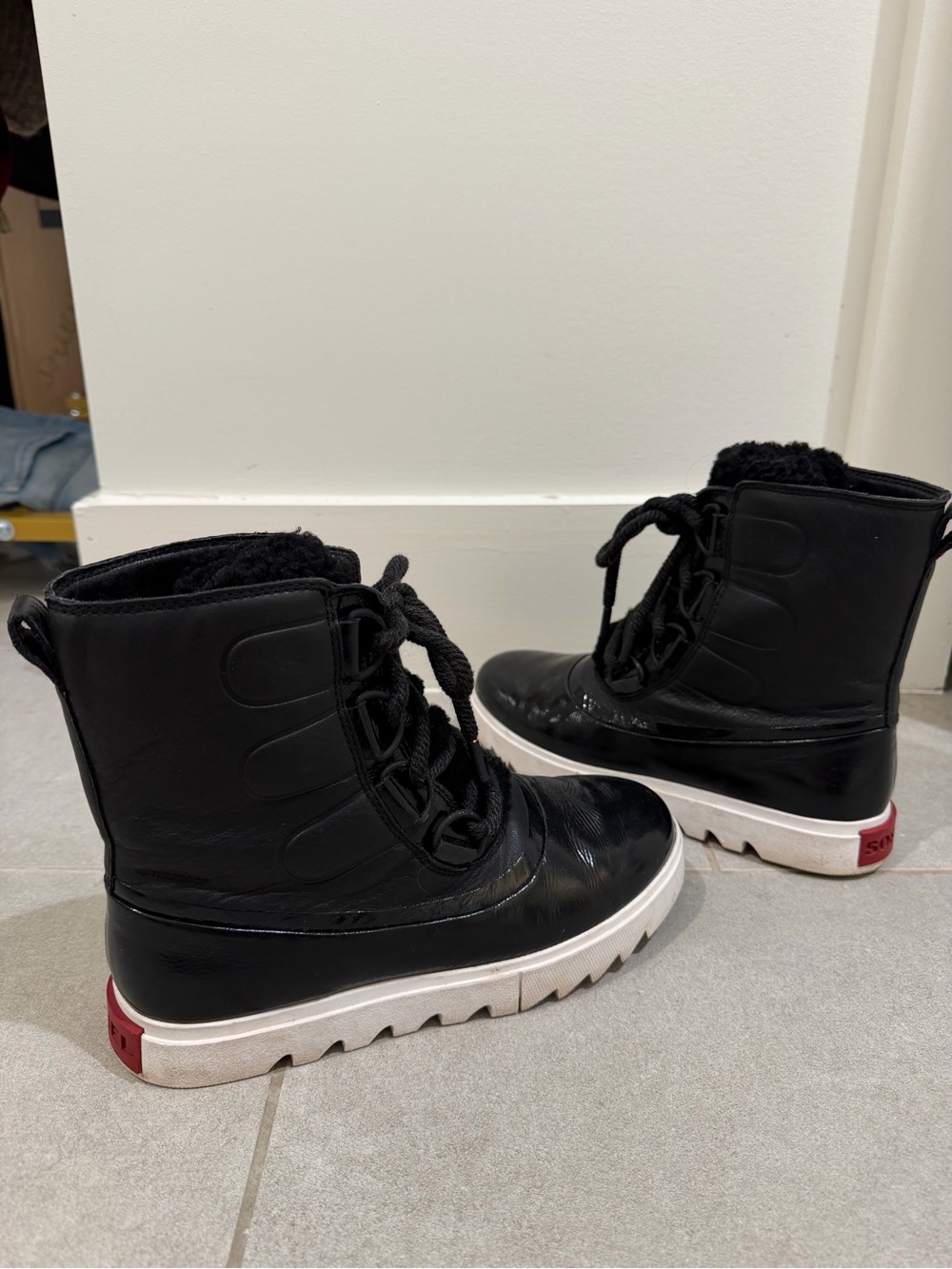 Sorel Black and White Lace-Up Ankle Booties with Red Accent